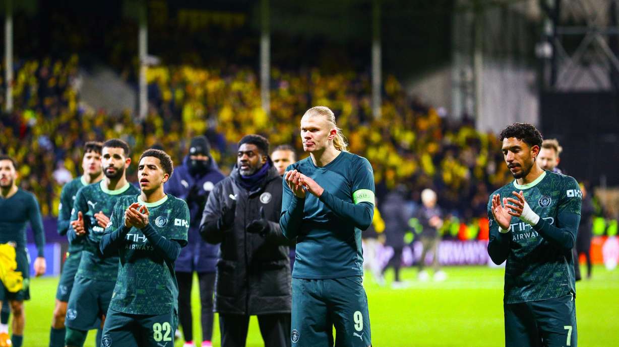 Manchester City's Erling Haaland, center, applauds the crowd after the Champions League soccer match between Bodo/Glimt and Manchester City in Bodo, Norway, Tuesday, Jan. 20, 2026.