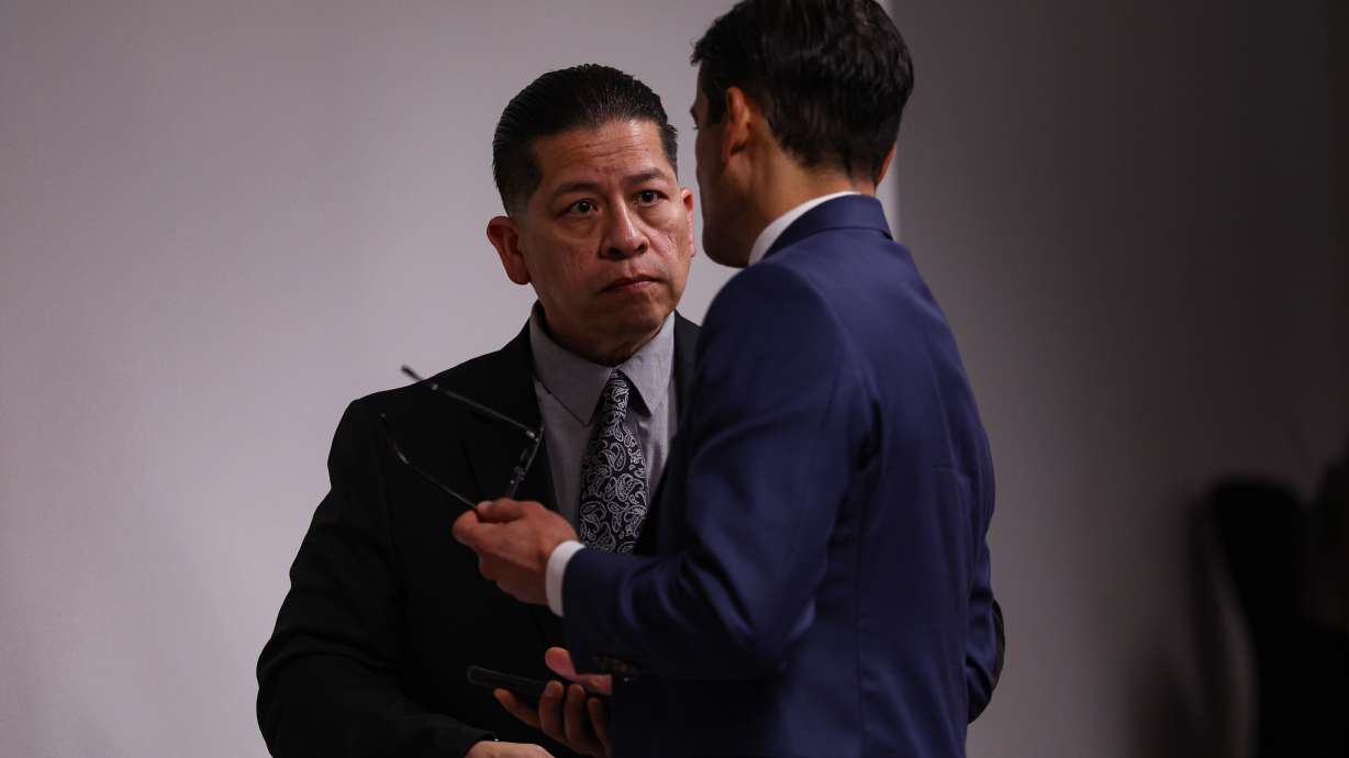 Former Uvalde school district police officer Adrian Gonzales, left, talks to his defense attorney Nico LaHood at his criminal trial in Corpus Christi, Texas, on Tuesday. A jury has acquitted a former school district police officer of all charges based on accusations he failed to act during the Robb Elementary shooting in Uvalde, Texas.