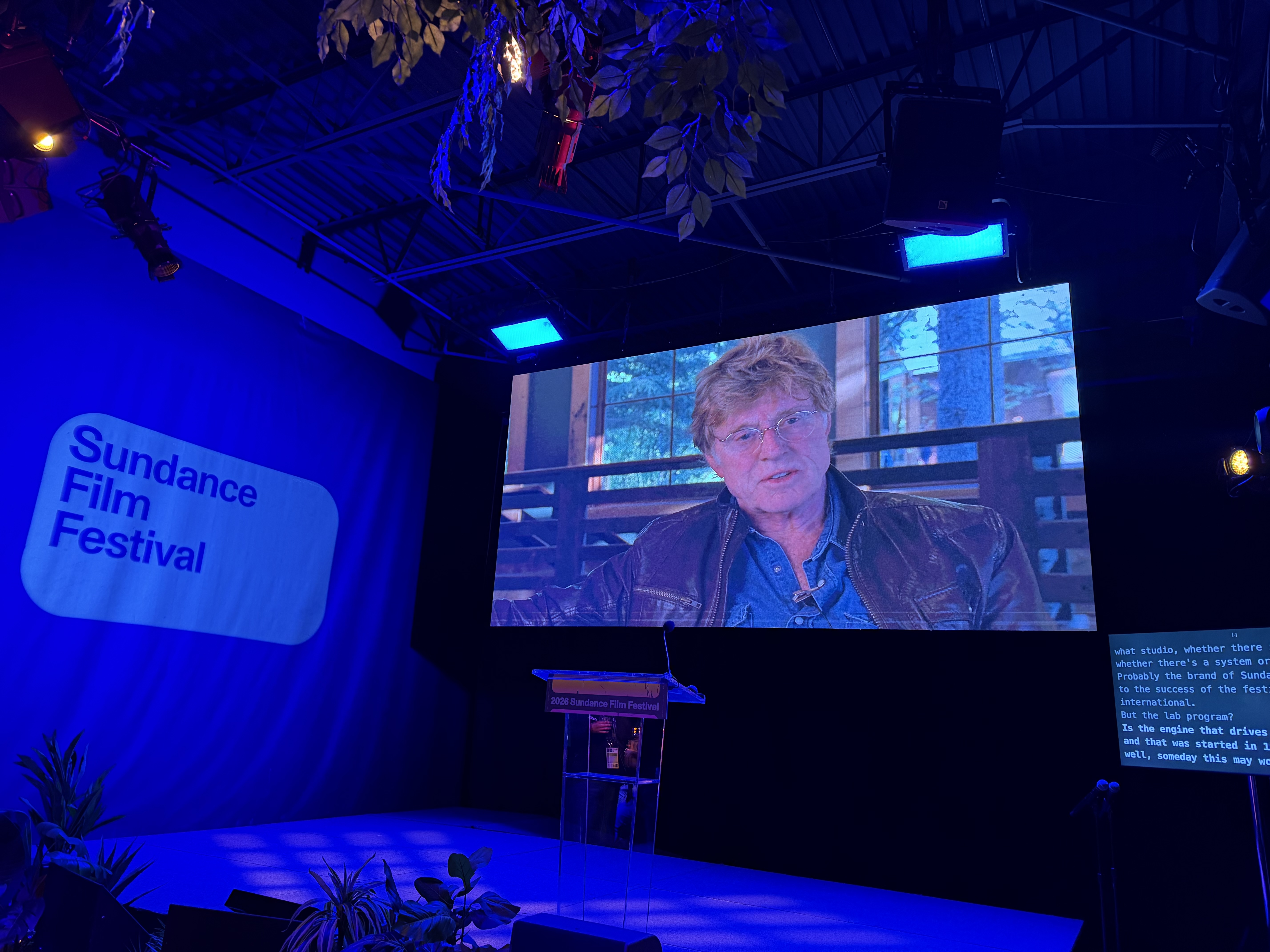 A video of Robert Redford plays during a Sundance Institute press event on Wednesday.