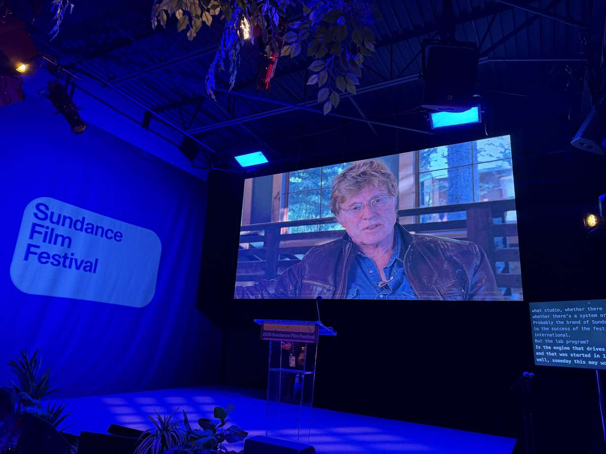 A video of Robert Redford plays during a Sundance Institute press event on Wednesday.