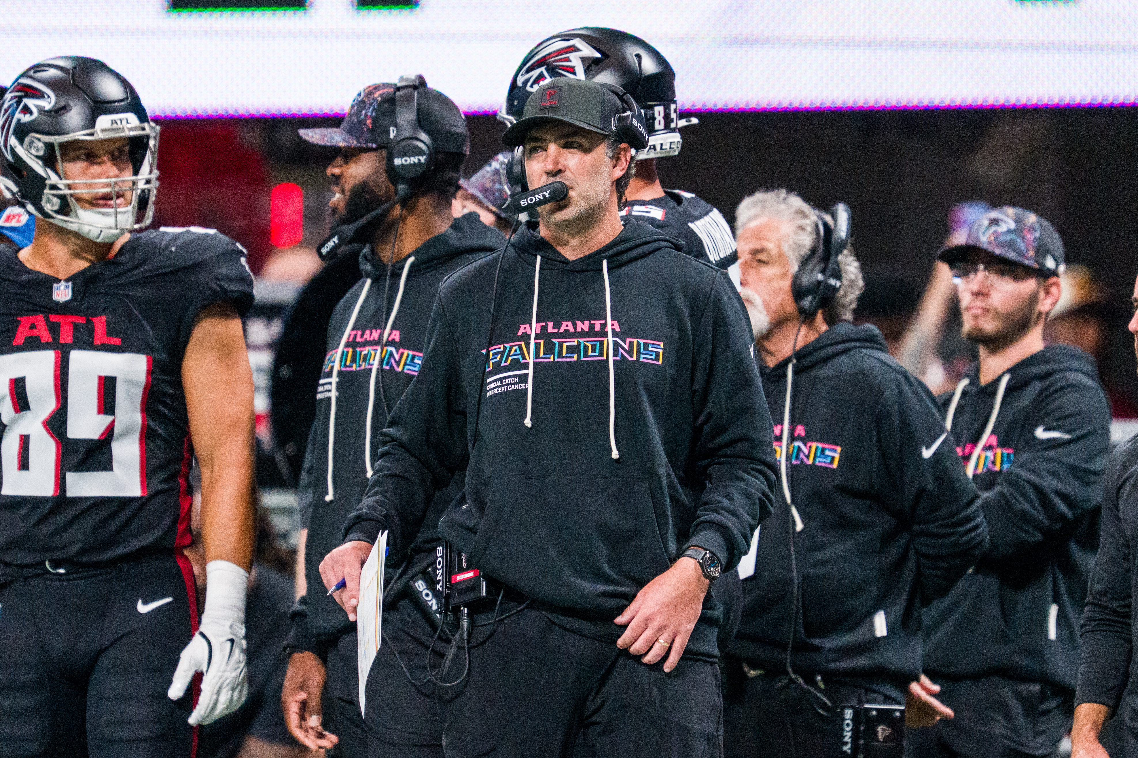 FILE - Atlanta Falcons offensive coordinator Zac Robinson works during the first half of an NFL football game against the Washington Commanders, Sunday, Sep. 28, 2025, in Atlanta. 