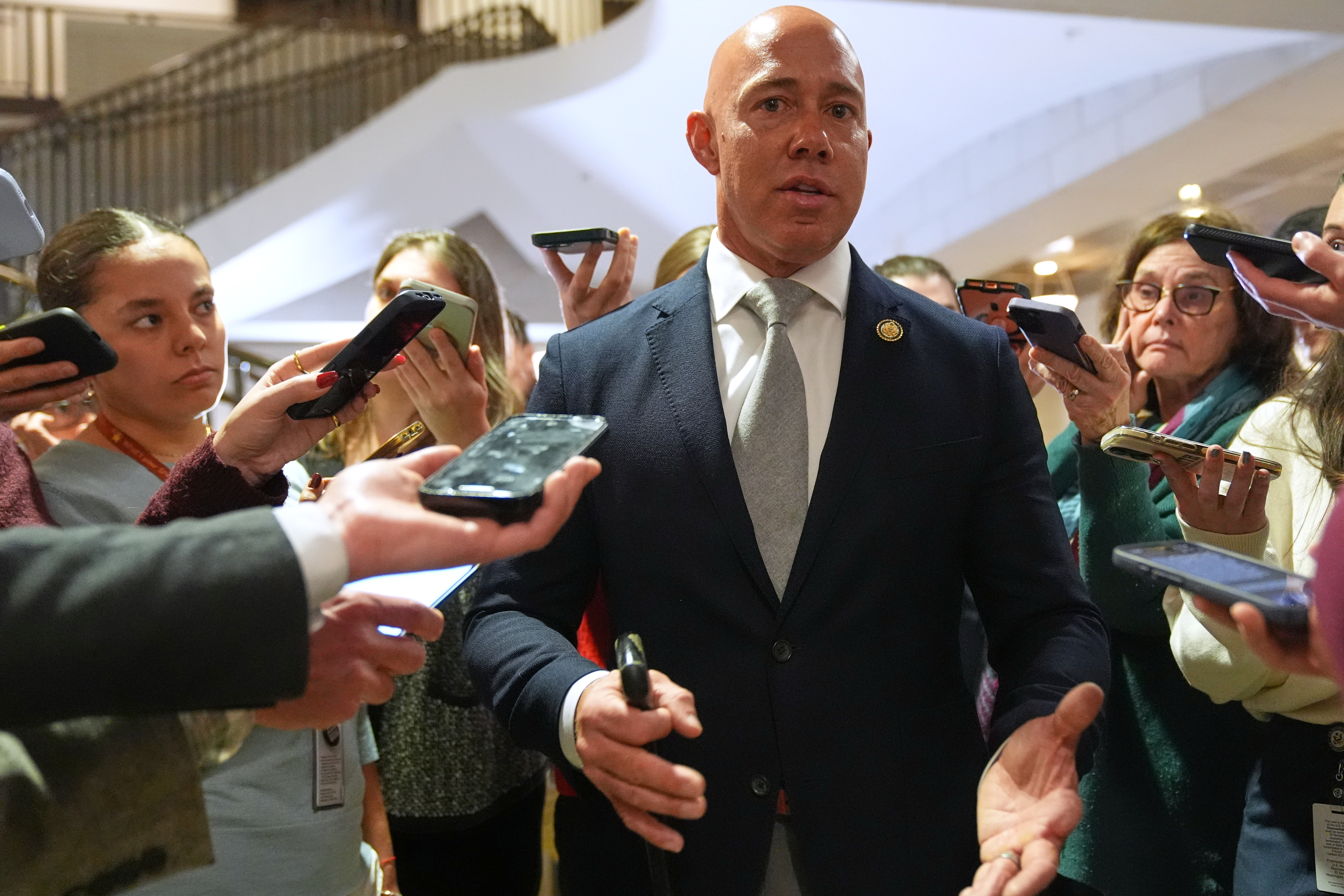 Rep. Brian Mast, R-Fla., speaks to reporters at the Capitol, Jan. 5, in Washington after a closed-door briefing. Mast argued against a war powers resolution on Thursday that eventually narrowly passed the House.