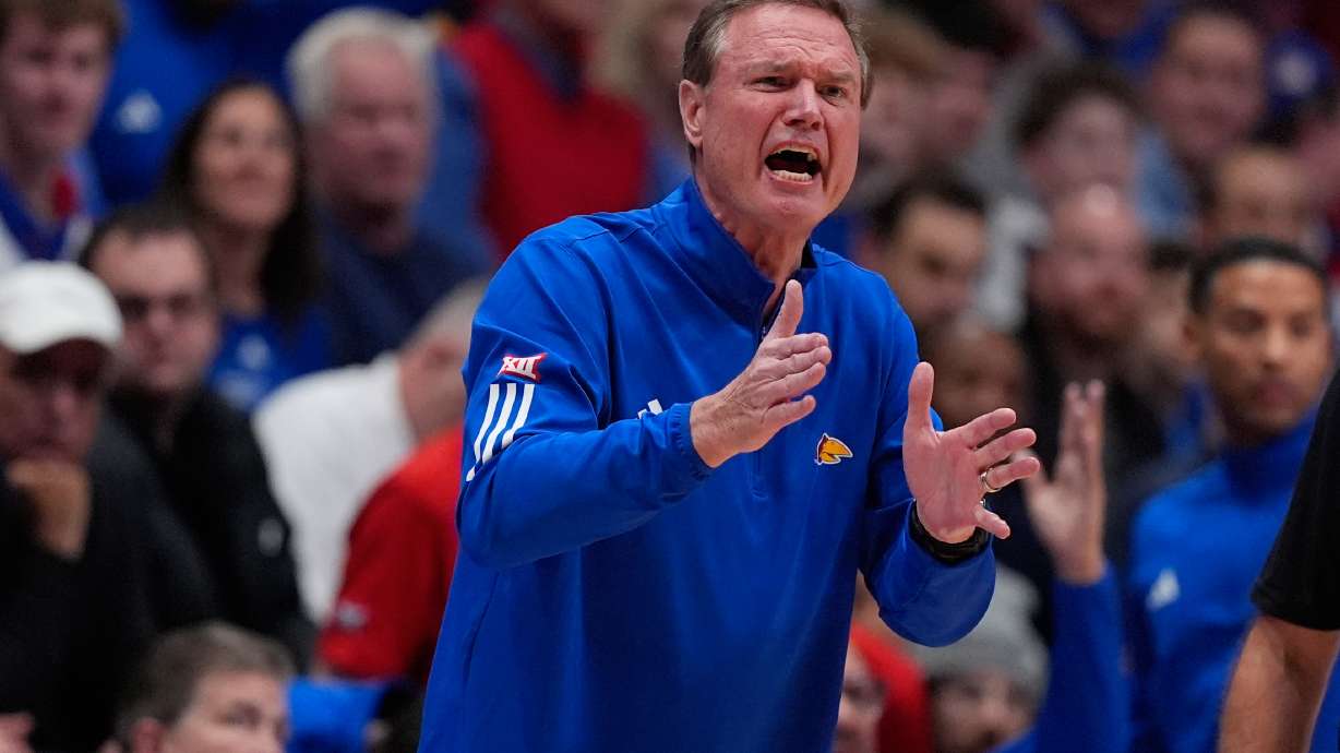 Kansas head coach Bill Self motions to his team during the first half of an NCAA college basketball game against Baylor, Friday, Jan. 16, 2026, in Lawrence, Kan.