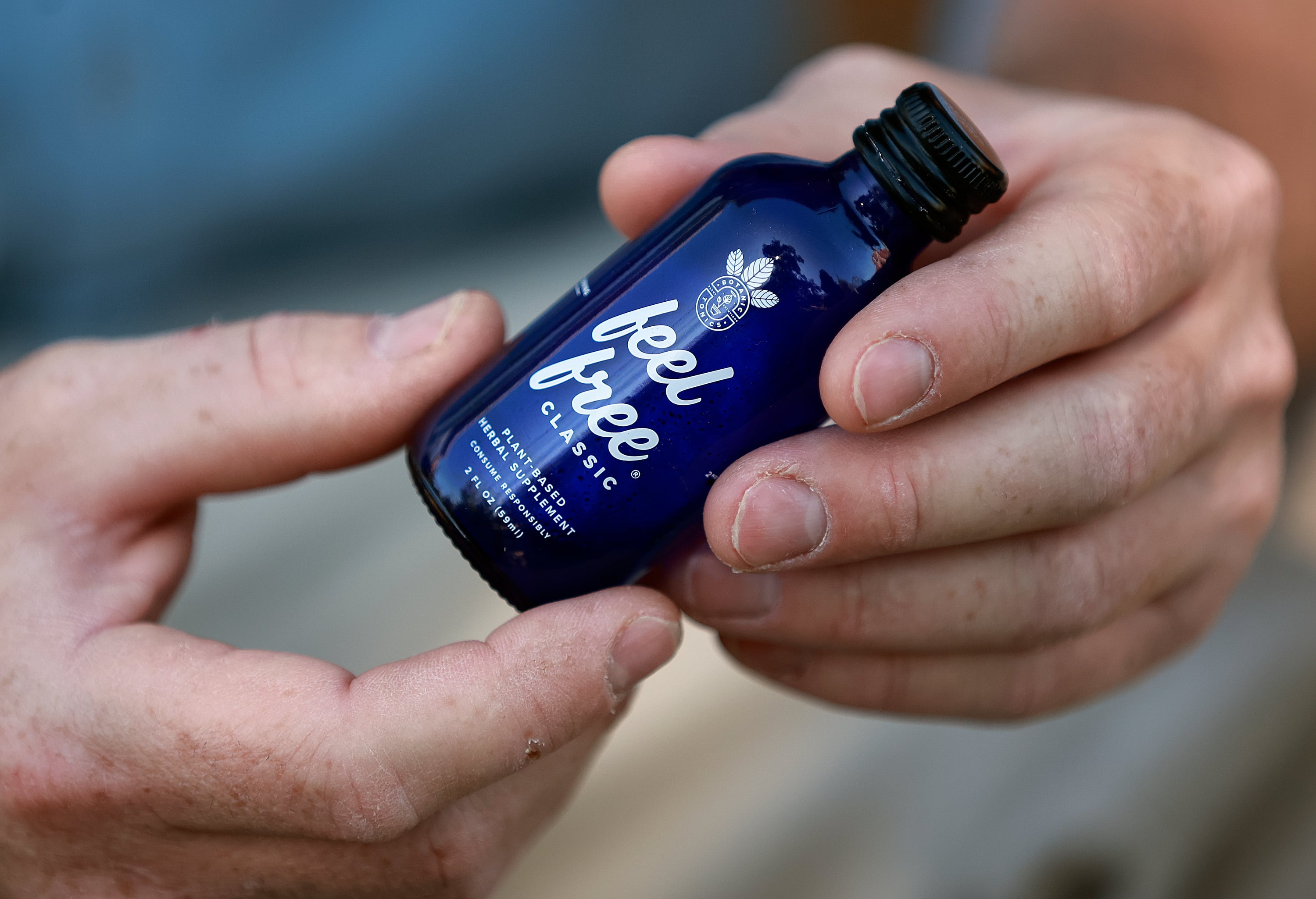 Chad Butterfield holds an old bottle of Kratom at his home in Holladay on Sept. 18, 2025. Butterfield was addicted to the readily available supplement Kratom, but has been sober from alcohol for two years and Kratom for six months.