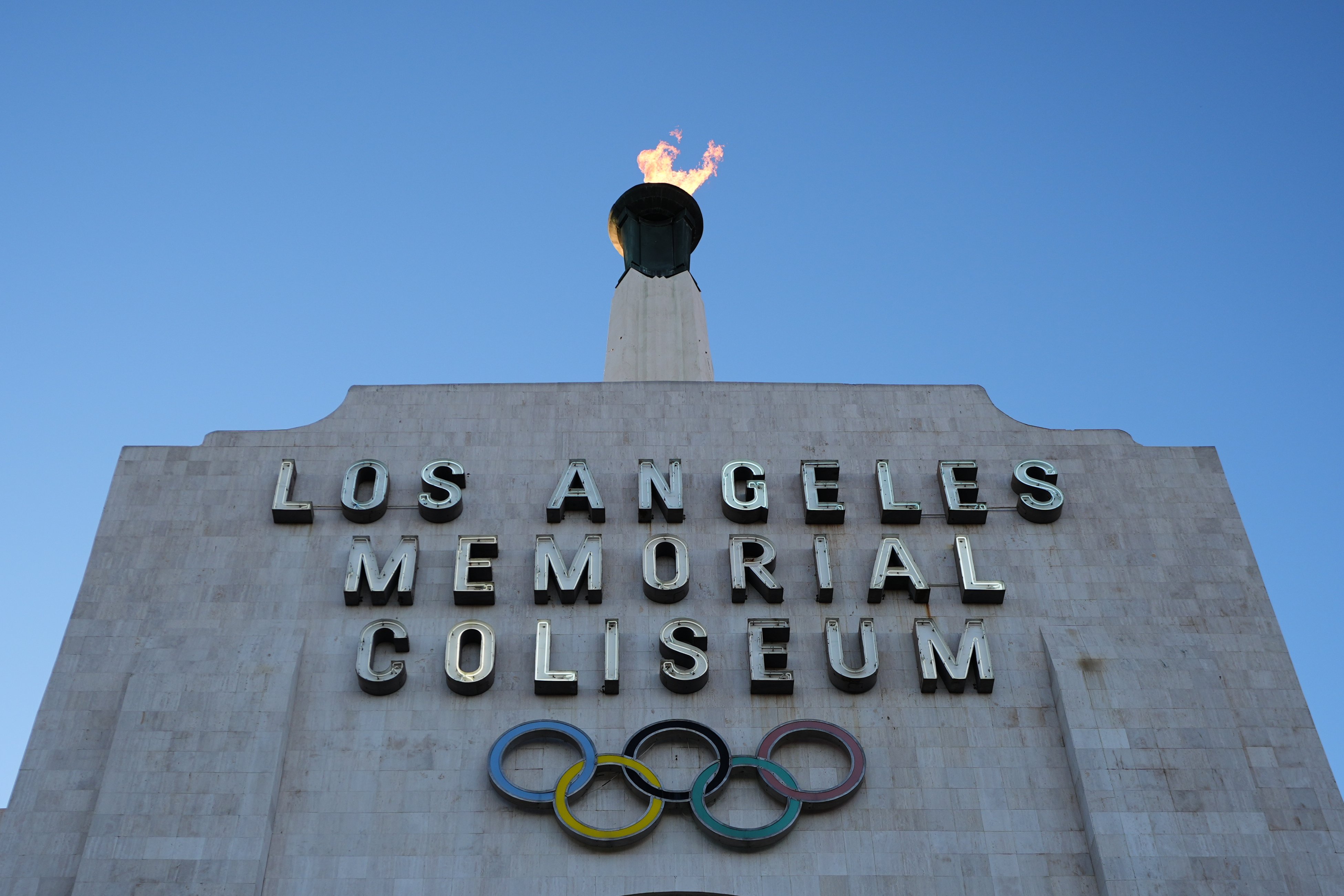 The Olympic cauldron is lit at the Los Angeles Memorial Coliseum ahead of the launch for ticket registration to the 2028 Summer Olympic Games Tuesday, Jan. 13, 2026, in Los Angeles. 