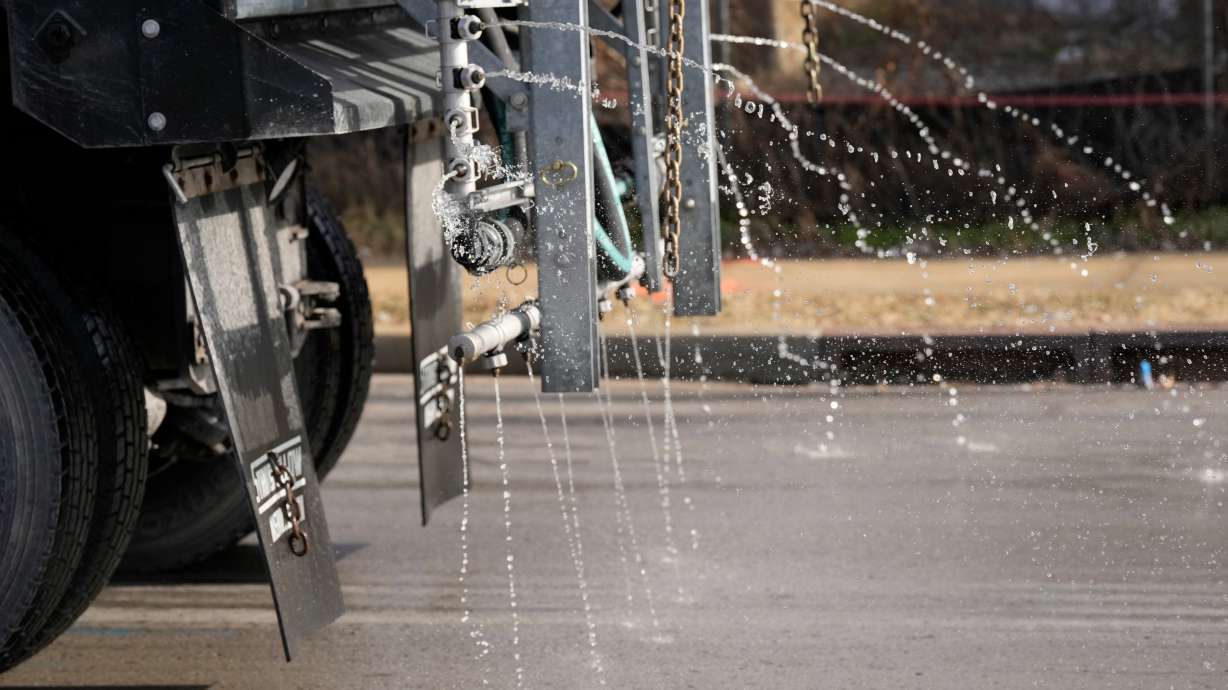 A Nashville Department of Transportation truck applies salt brine to a roadway Thursday, in Nashville, Tenn., ahead of a winter storm expected to hit the state over the weekend. Forecasters said over half the country could be affected by the storm.