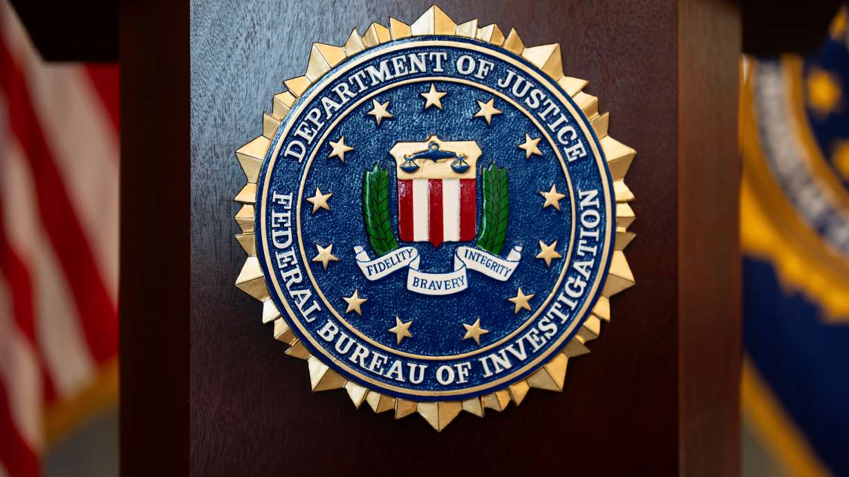 An FBI seal is displayed on a podium before a news conference at the field office in Portland, Ore., Jan. 16.
