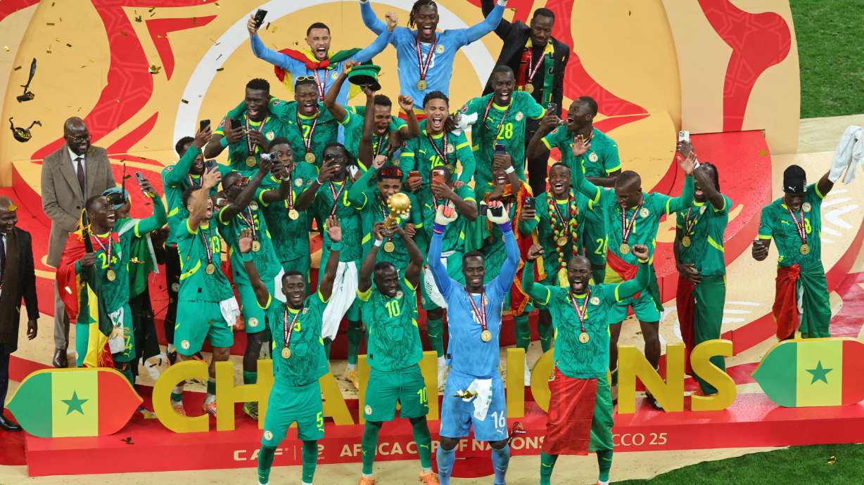 Senegal's Sadio Mane holds the trophy aloft as he celebrates with teammates after winning the Africa Cup of Nations final soccer match between Senegal and Morocco in Rabat, Morocco, Sunday, Jan. 18, 2026.