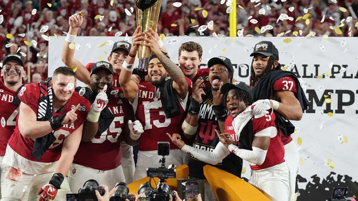 Indiana holds the trophy after their win against Miami in the College Football Playoff national championship game, Monday, Jan. 19, 2026, in Miami Gardens, Fla.