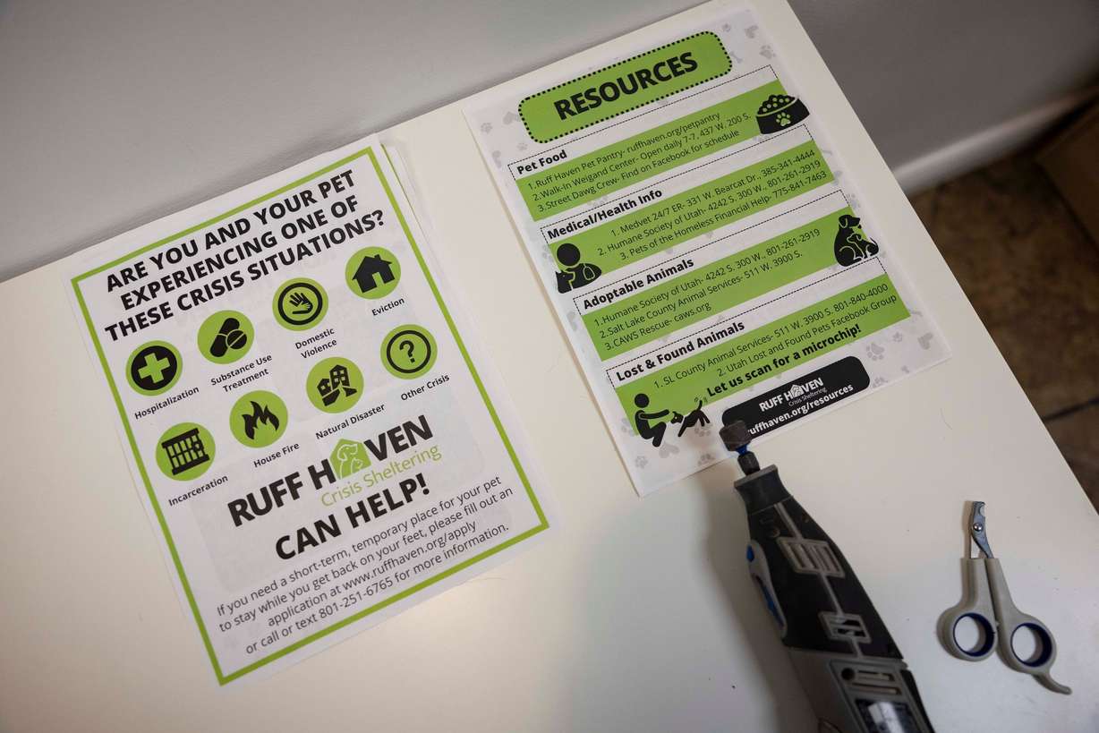 Pamphlets with information for clients sit on a table at Ruff Haven Crisis Sheltering in Salt Lake City on Thursday. The shelter also offers other services, such as grooming and vaccinations for pets.