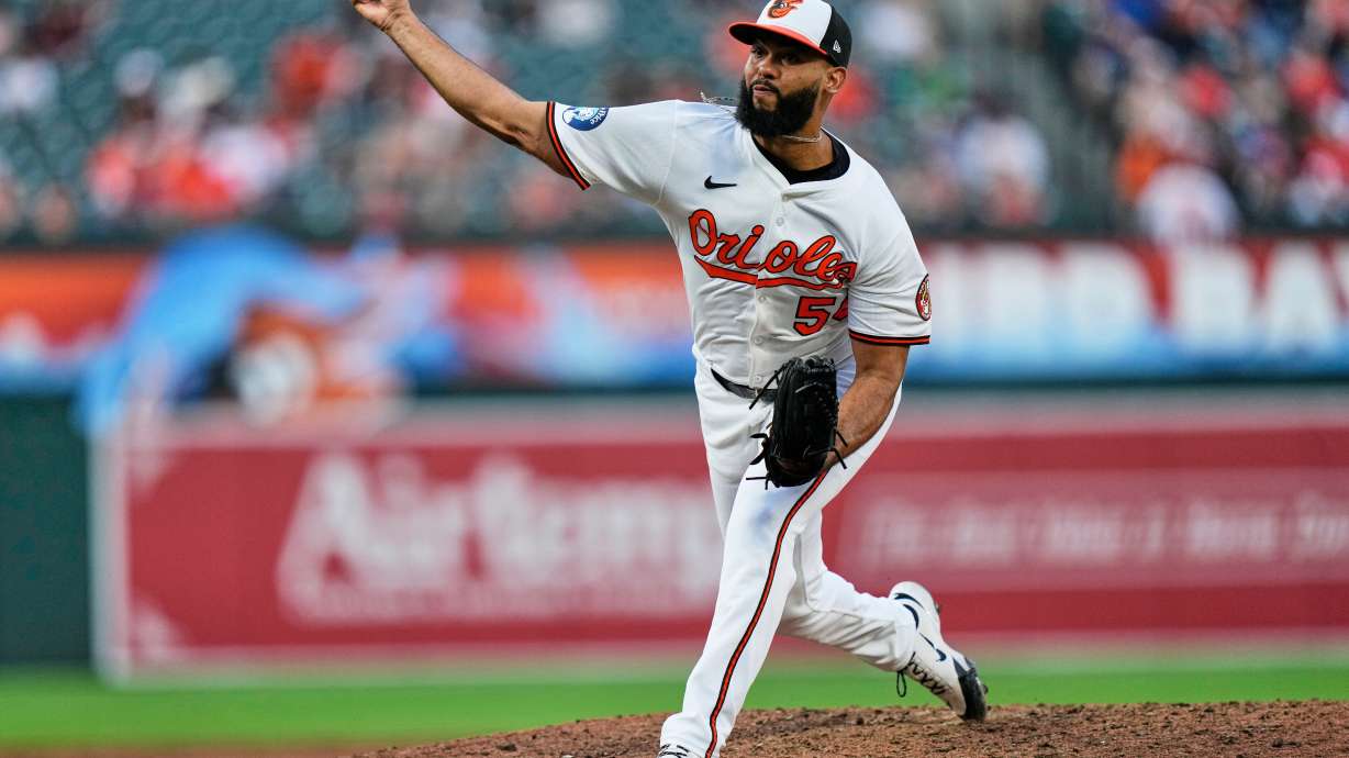 FILE - Baltimore Orioles relief pitcher Seranthony Dominguez (56) delivers during the ninth inning in the second baseball game of a doubleheader against the New York Mets, July 10, 2025, in Baltimore.