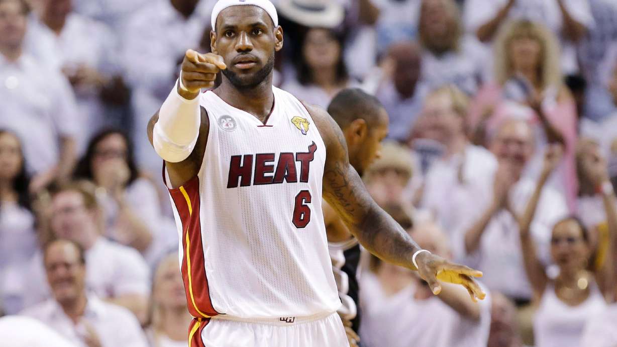 FILE - Miami Heat's LeBron James (6) gestures after a play against the San Antonio Spurs during the first half in Game 7 of the NBA basketball championships, June 20, 2013, in Miami.