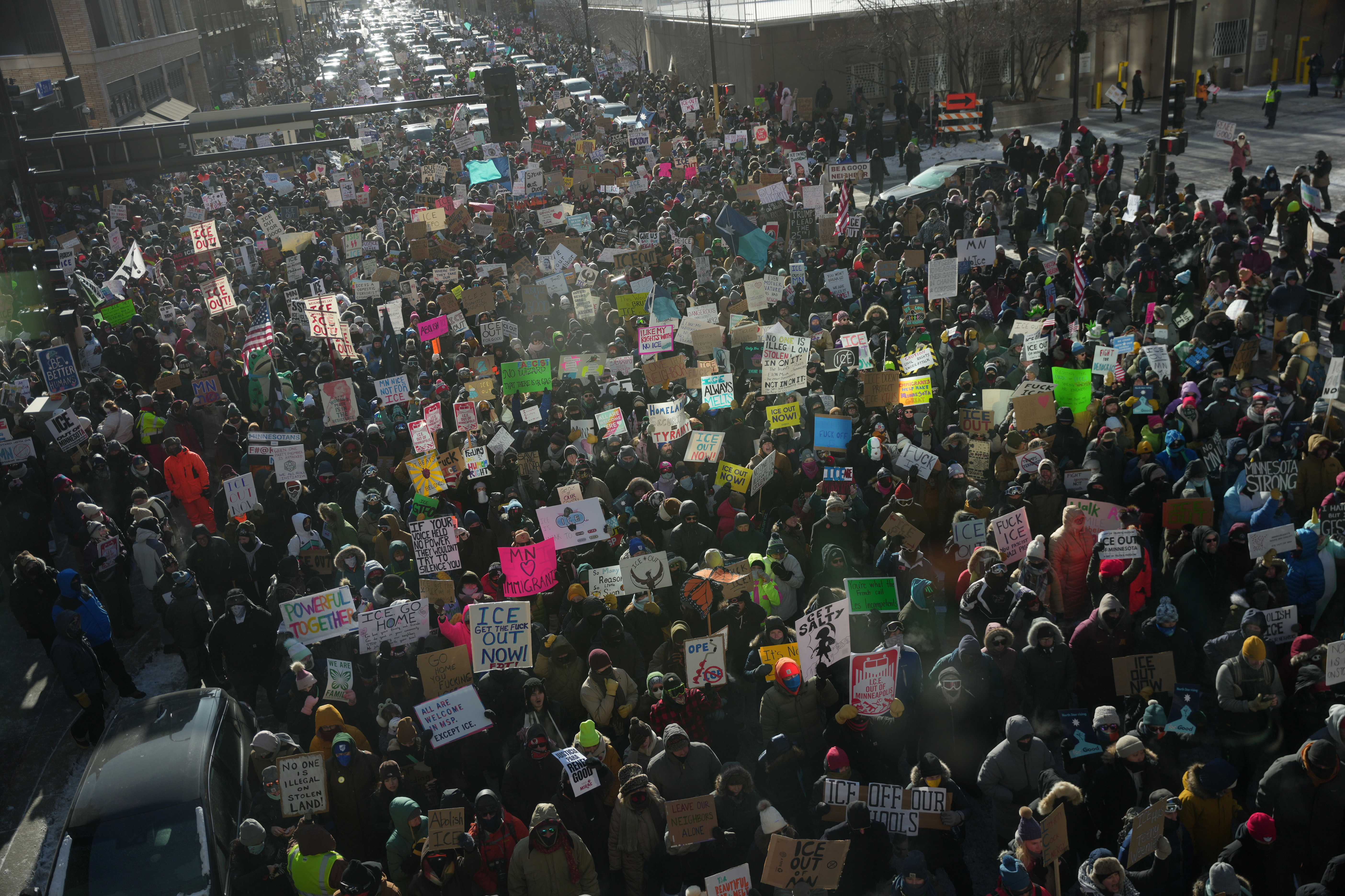 People protest against federal immigration agents on Friday in Minneapolis. The protests are part of a broader movement against President Donald Trump's immigration crackdown statewide in Minnesota.