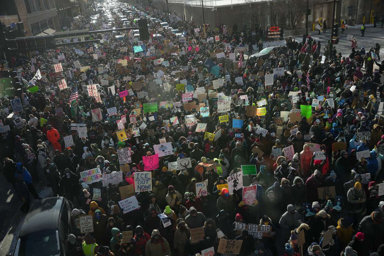 People protest against federal immigration agents on Friday in Minneapolis. The protests are part of a broader movement against President Donald Trump's immigration crackdown statewide in Minnesota.