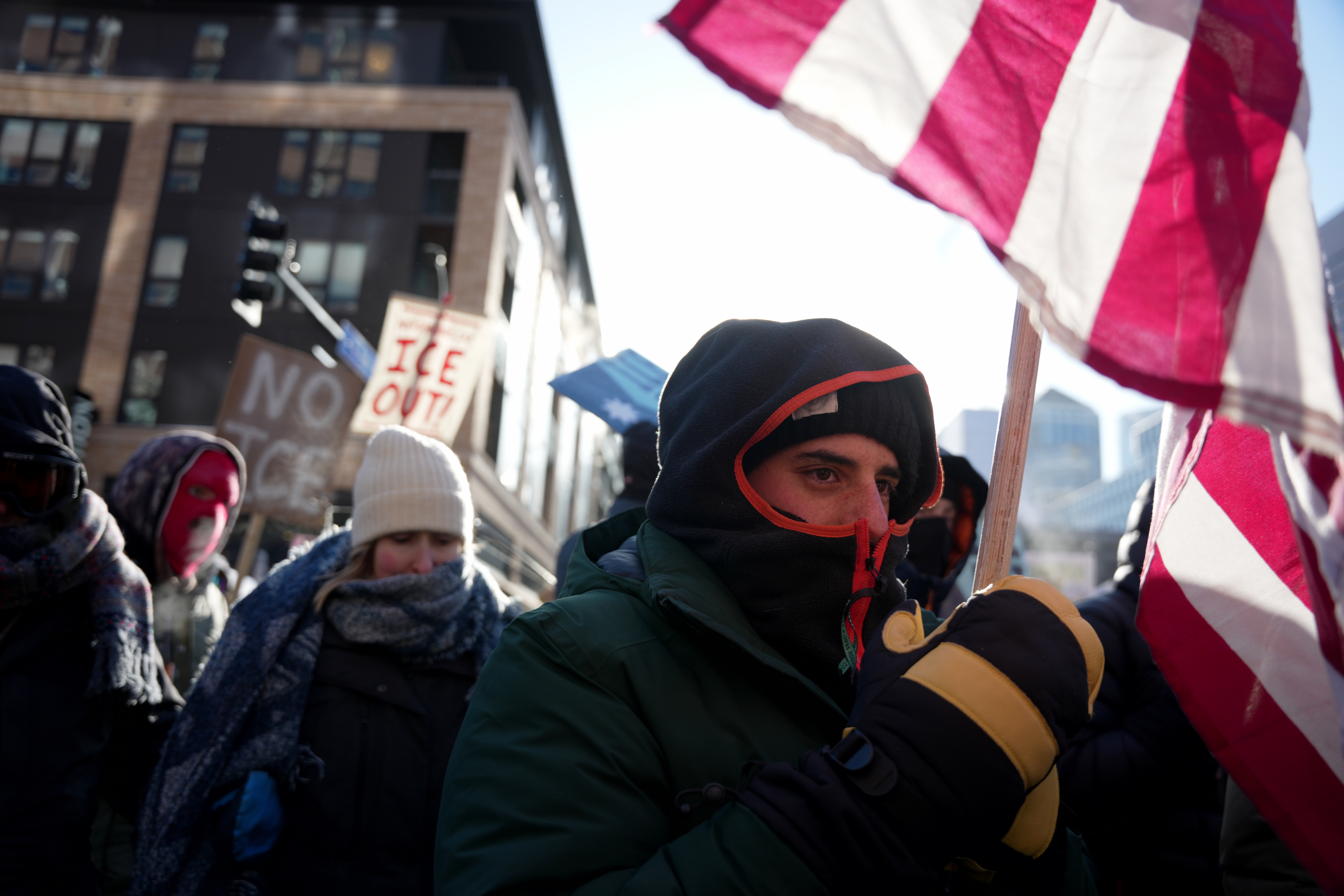 People protest against federal immigration agents on Friday in Minneapolis. The high temperature was minus 9 degrees in the city.
