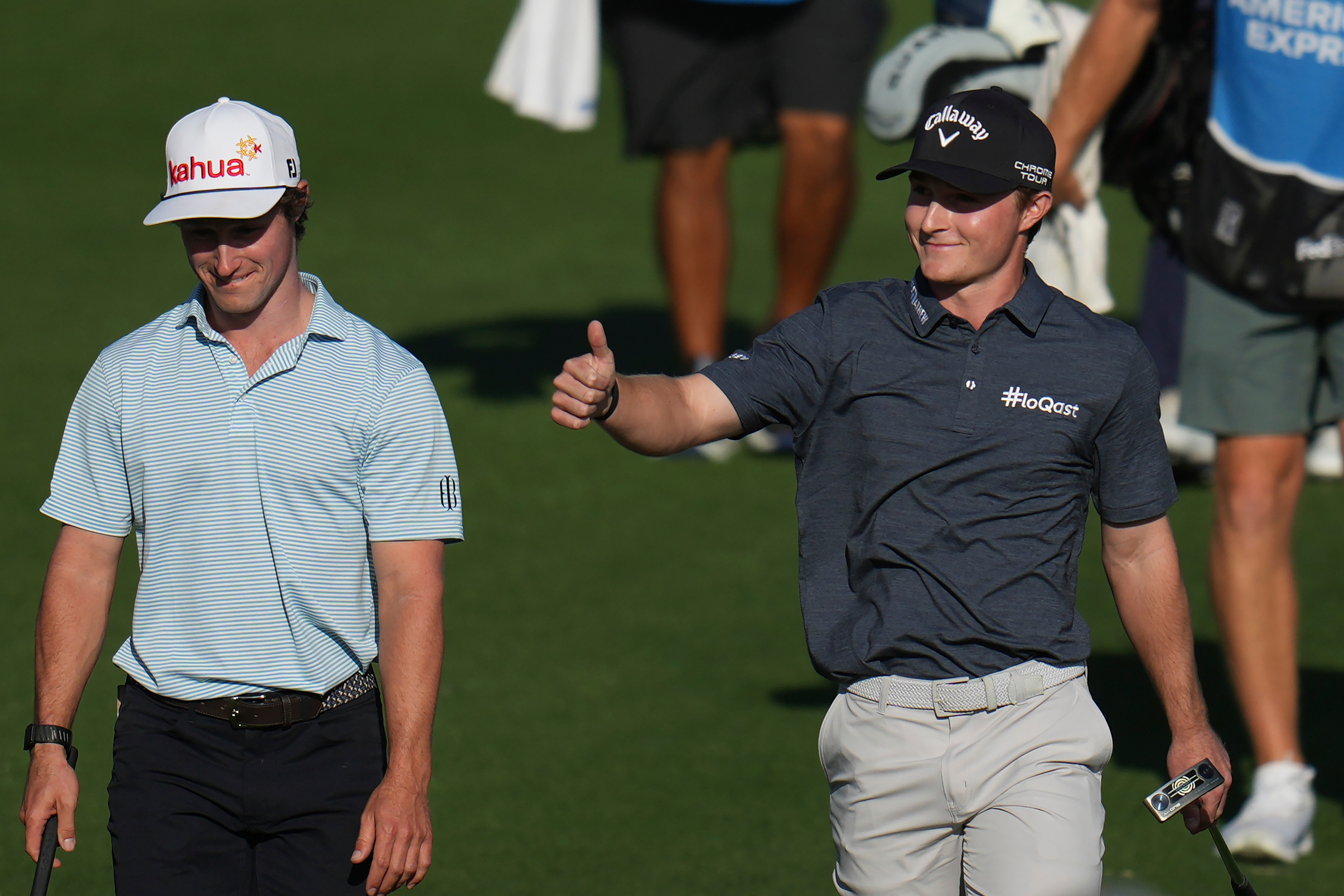 Blades Brown, right, reacts for a cheering gallery as he walks with David Ford as the gallery cheers for Brown who finished with a 12-under-par 60 during the second round of the American Express golf event at the Jack Nicklaus Tournament Course at PGA West Friday, Jan. 23, 2026, in La Quinta, Calif. 