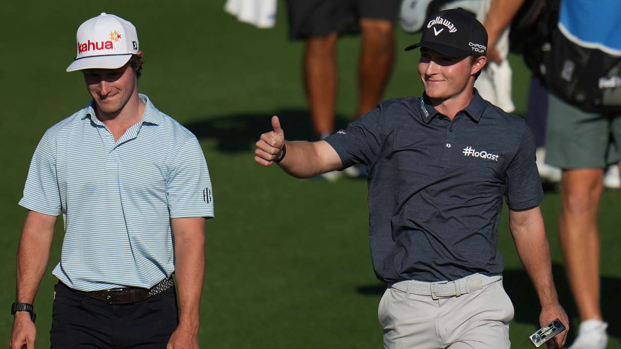 Blades Brown, right, reacts for a cheering gallery as he walks with David Ford as the gallery cheers for Brown who finished with a 12-under-par 60 during the second round of the American Express golf event at the Jack Nicklaus Tournament Course at PGA West Friday, Jan. 23, 2026, in La Quinta, Calif.