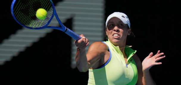 Sinner overcomes cramps, heat to continue his title defense at the Australian Open