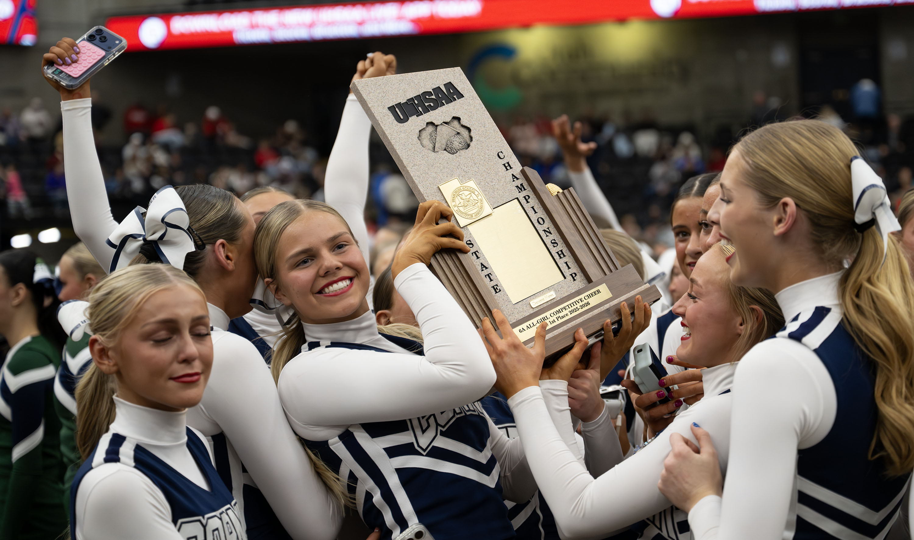 Corner Canyon cheerleaders celebrate their 6A all girl state championship at UVU in Orem on Friday, Jan. 23, 2026.