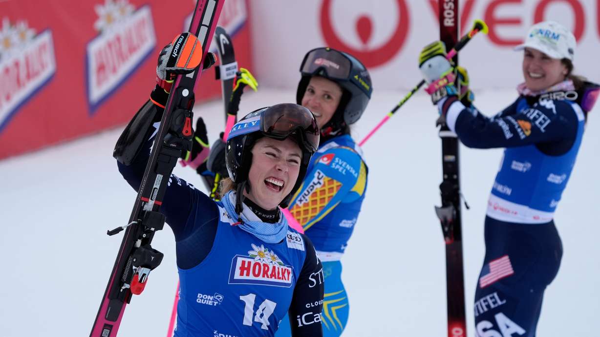 From left, United States' Mikaela Shiffrin, Sweden's Sara Hector and United States' Paula Moltzan at finish line during a women¥s alpine ski, World Cup giant slalom, in Spindleruv Mlyn, Czech Republic, Saturday, Jan. 24, 2026.