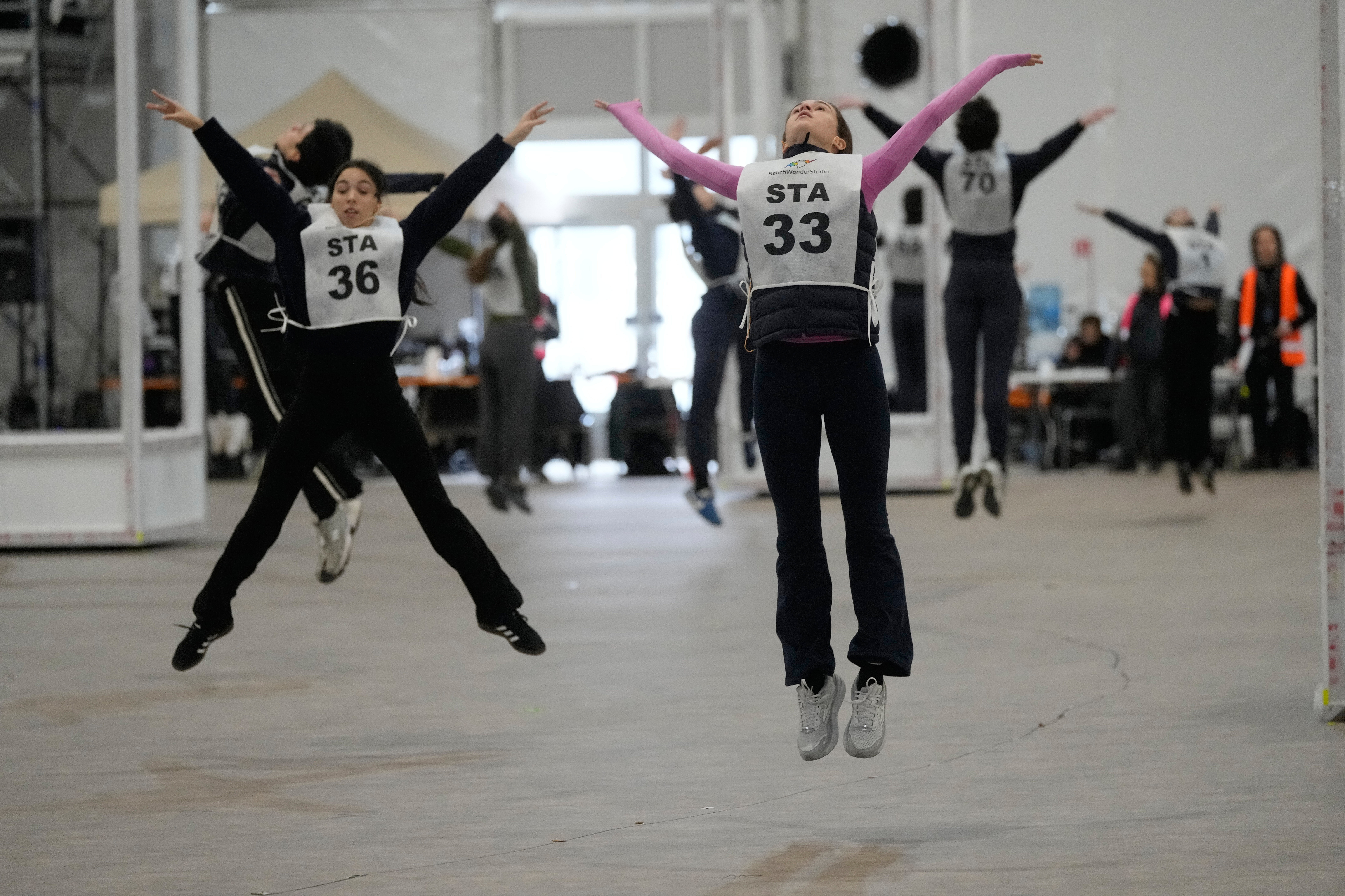 Volunteer dancers perform during rehearsals for the opening ceremony of the Milan Cortina 2026 Winter Olympic Games, at a compound in a big tent next to San Siro Stadium, in Milan, Italy, Saturday, Jan. 24, 2026. 