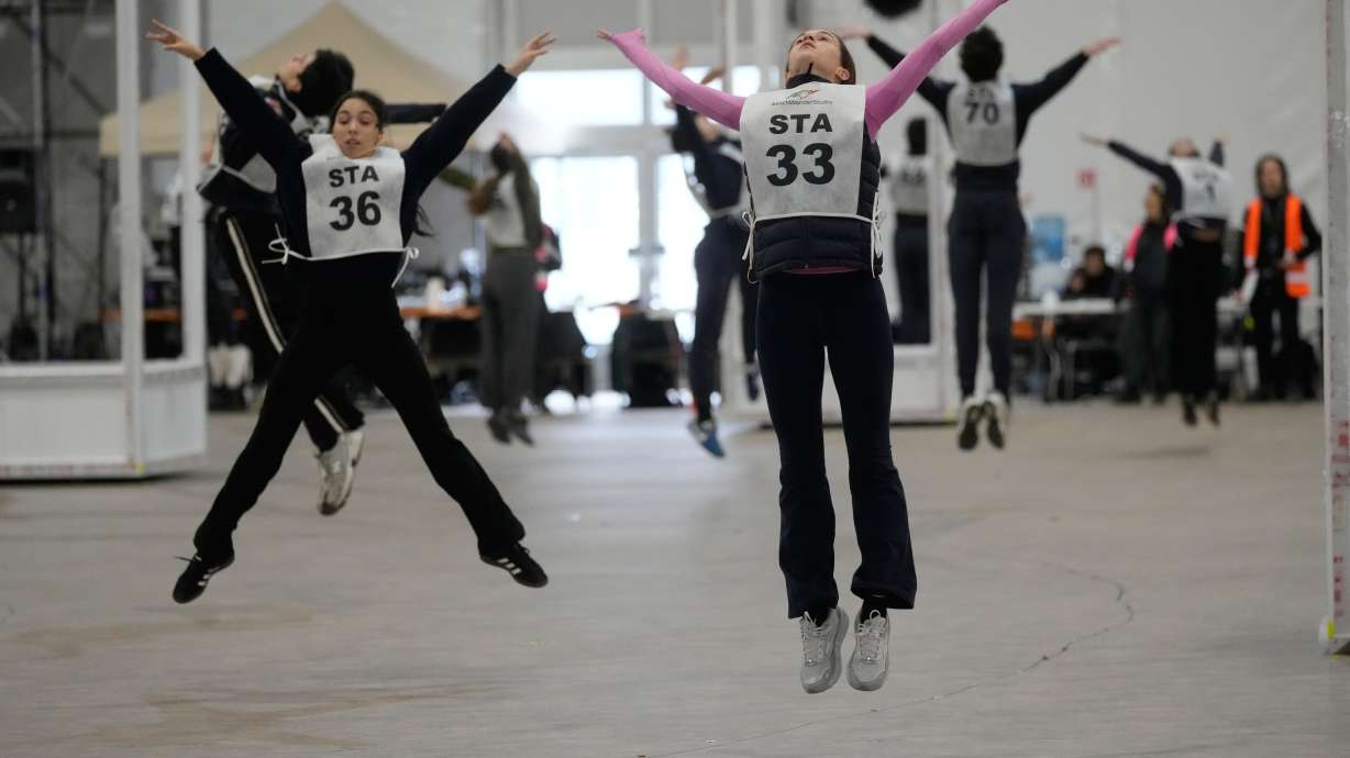Volunteer dancers perform during rehearsals for the opening ceremony of the Milan Cortina 2026 Winter Olympic Games, at a compound in a big tent next to San Siro Stadium, in Milan, Italy, Saturday, Jan. 24, 2026.