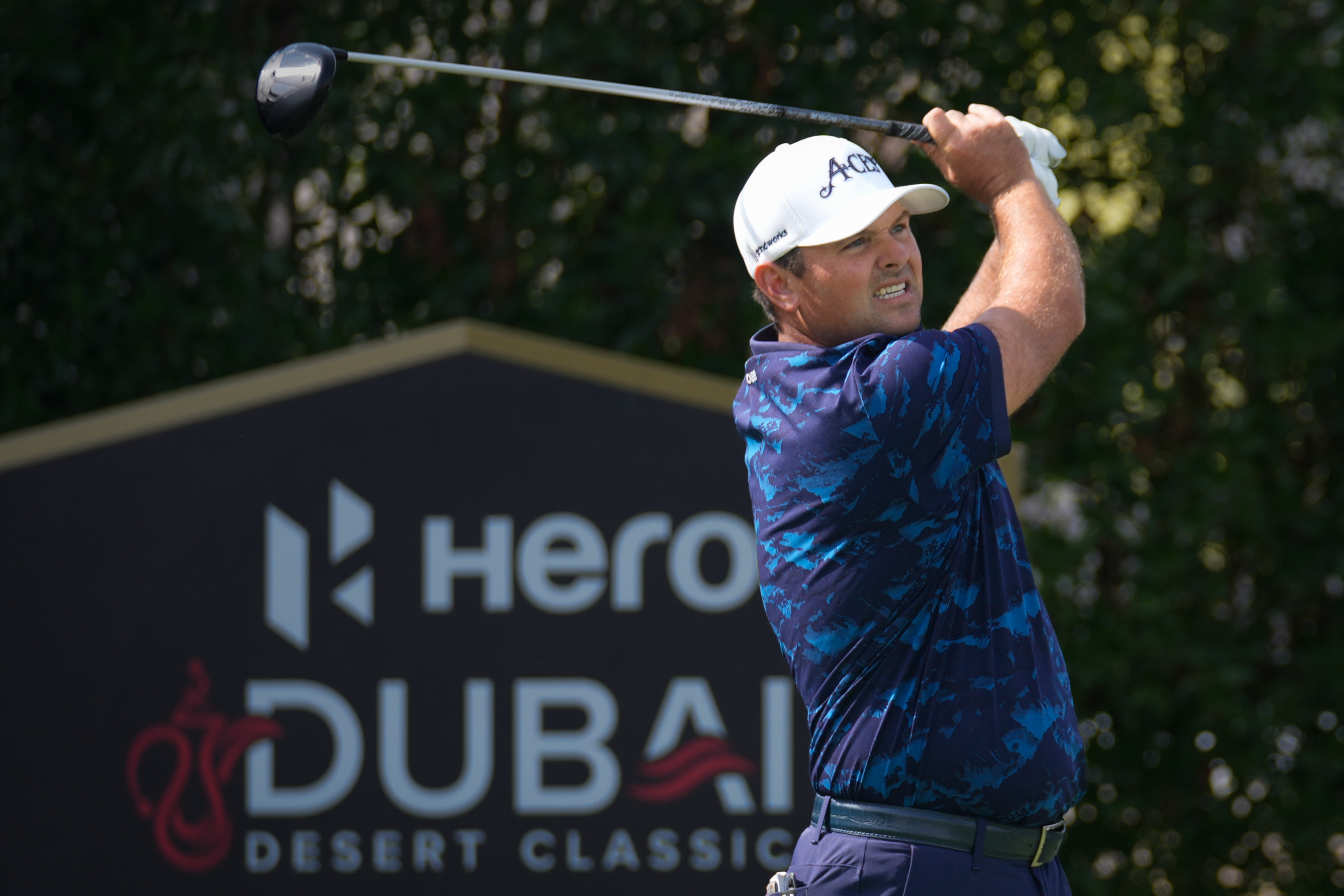 Patrick Reed of the United States tees off at 2nd hole during the third round of the Dubai Desert Classic in United Arab Emirates, Saturday, Jan. 24, 2026. 