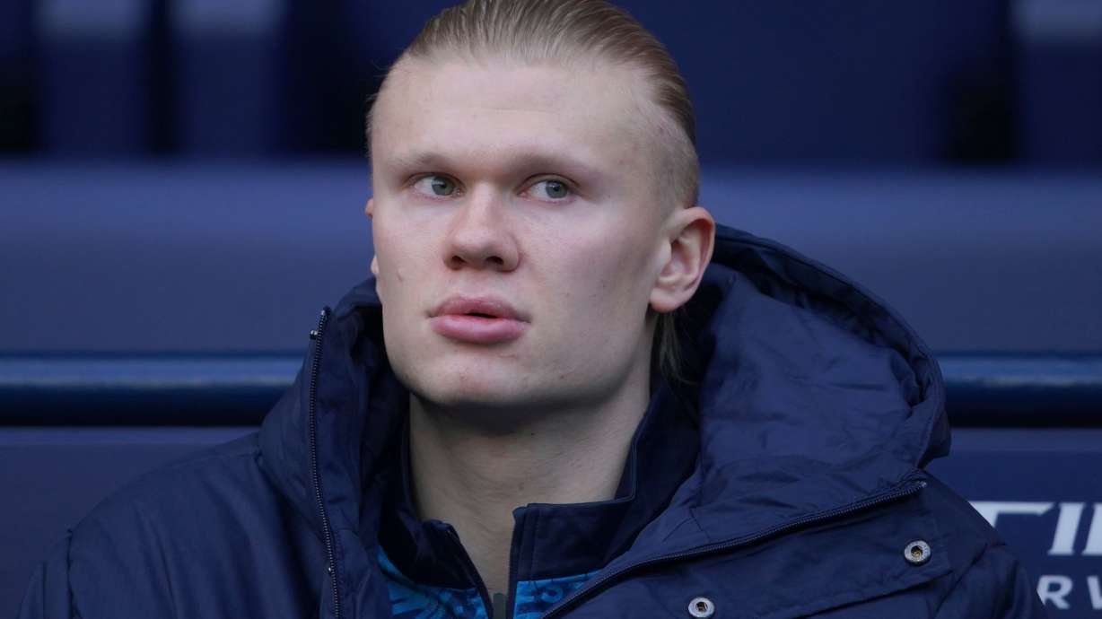 Manchester City's Erling Haaland sits in the dug out before the start of the English Premier League soccer match between Manchester City and Wolverhampton Wanderers in Manchester, England, Saturday, Jan. 24, 2026.