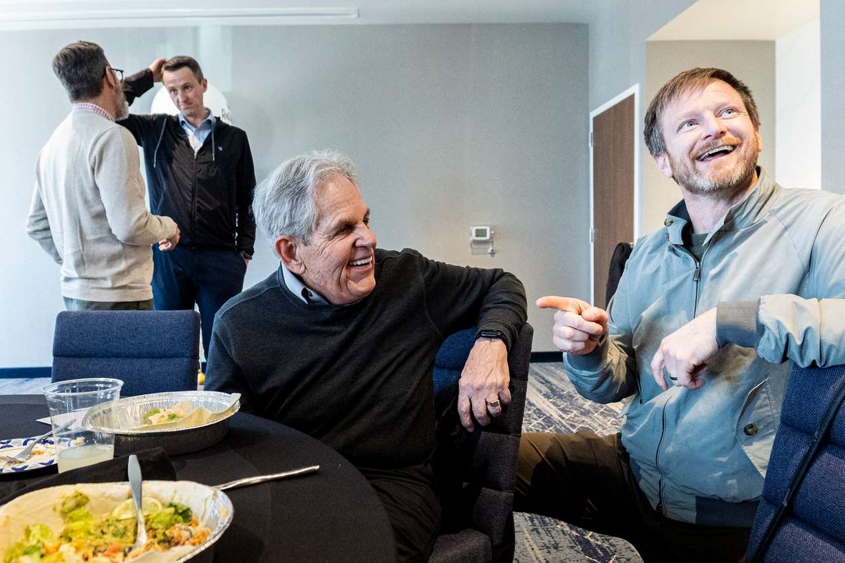 Joshua B. Woodbury, executive vice president of acquisitions and development at Woodbury Corporation, points to Rob Kallas, outgoing general manager for University Place, as Woodbury jokes and says his goodbyes during a retirement party for Kallas, held at the Courtyard by Marriott Orem University Place hotel on Jan. 15.