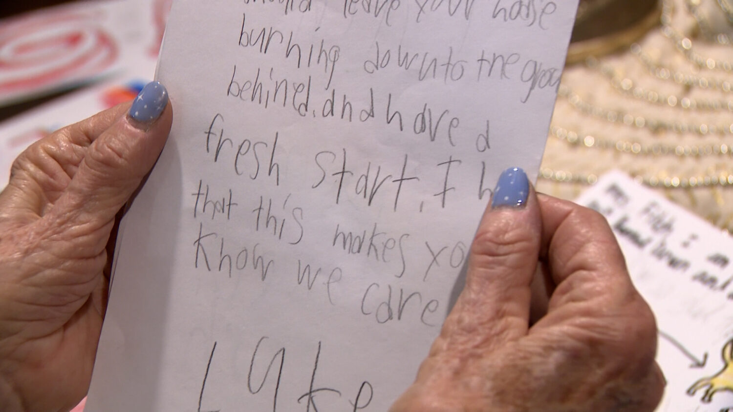 Karen Fitch holds a handwritten letter from a student at Granite Elementary School, Friday. The card drew laughs and lifted Fitch's spirit.