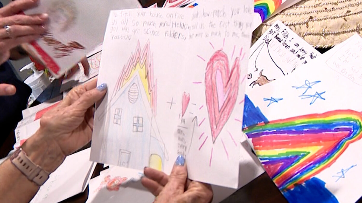 Karen Fitch holds a handwritten card from a student at Granite Elementary School, Friday. The cards and support have been pouring in since Fitch lost her home in a fire on Wednesday.