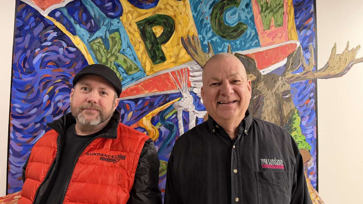 Sandy resident Sean Leslie and Pleasant Grove resident Mike Wisland show off some of their Sundance Film Festival merch from 2013 and 1998. Combined, they have seen more than 1,500 films at Sundance.