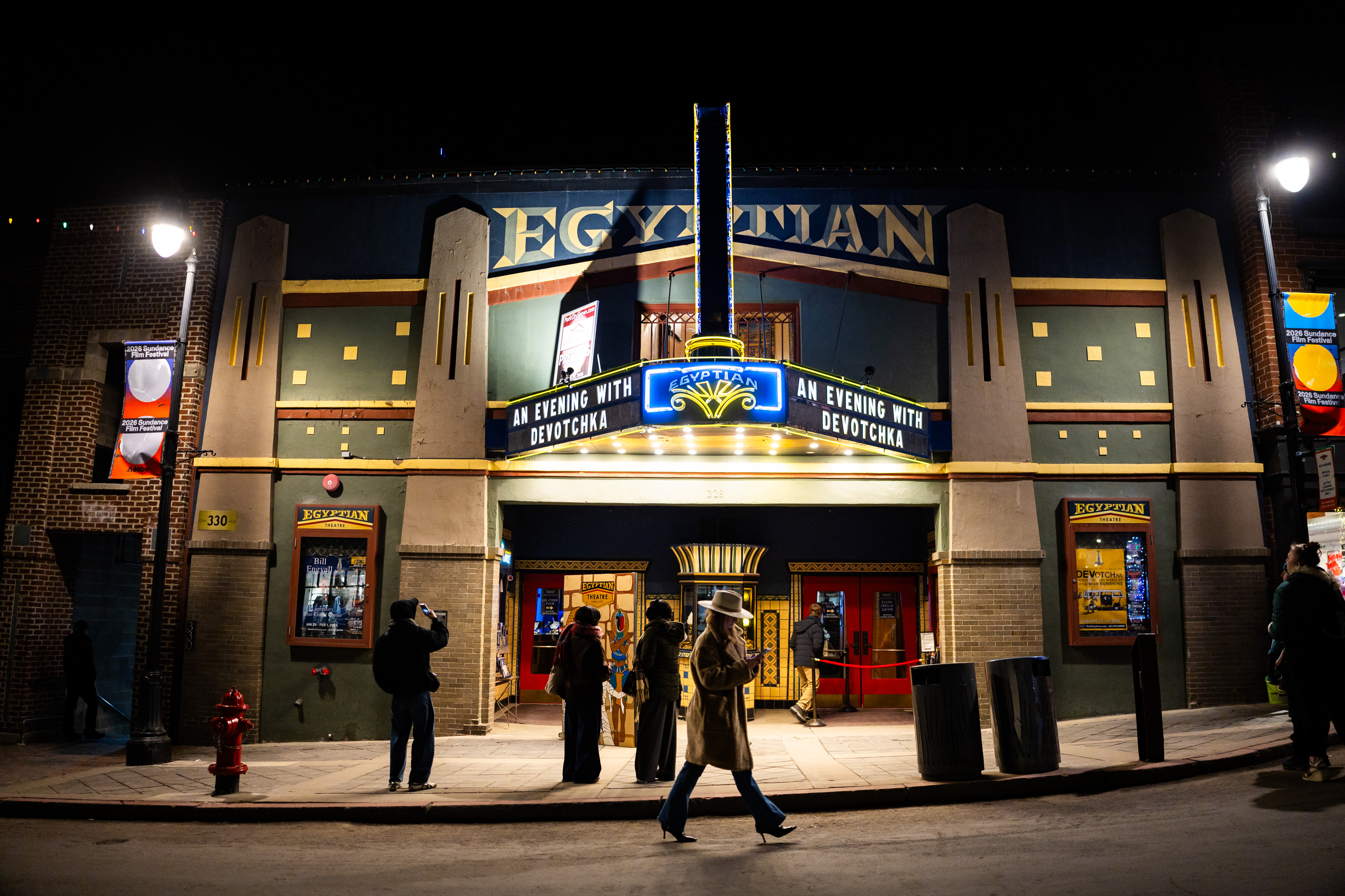 People walk on Main Street outside the Egyptian Theater in Park City during the final Sundance Film Festival in Utah on Friday.