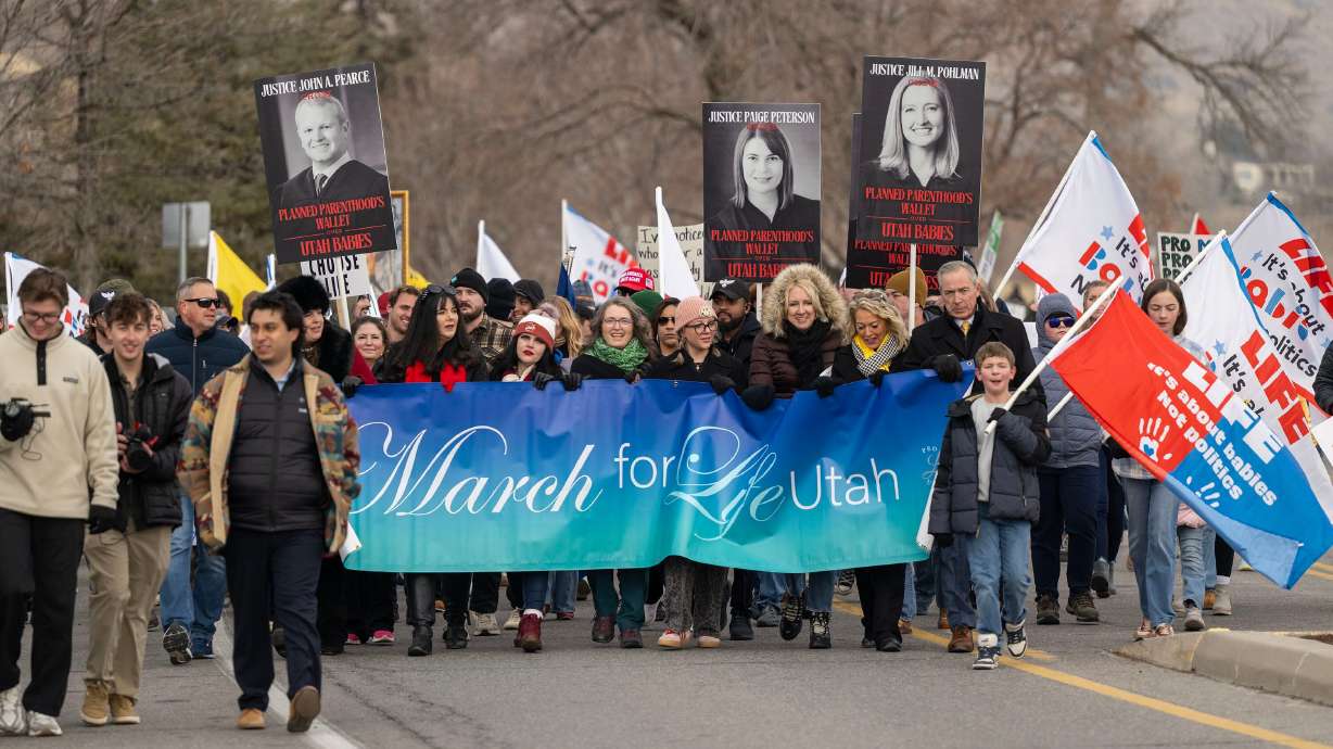 Rally attendees take part in a March for Life event at the Capitol in Salt Lake City, on Saturday. The event comes four months before oral arguments begin in a long legal battle over abortion.