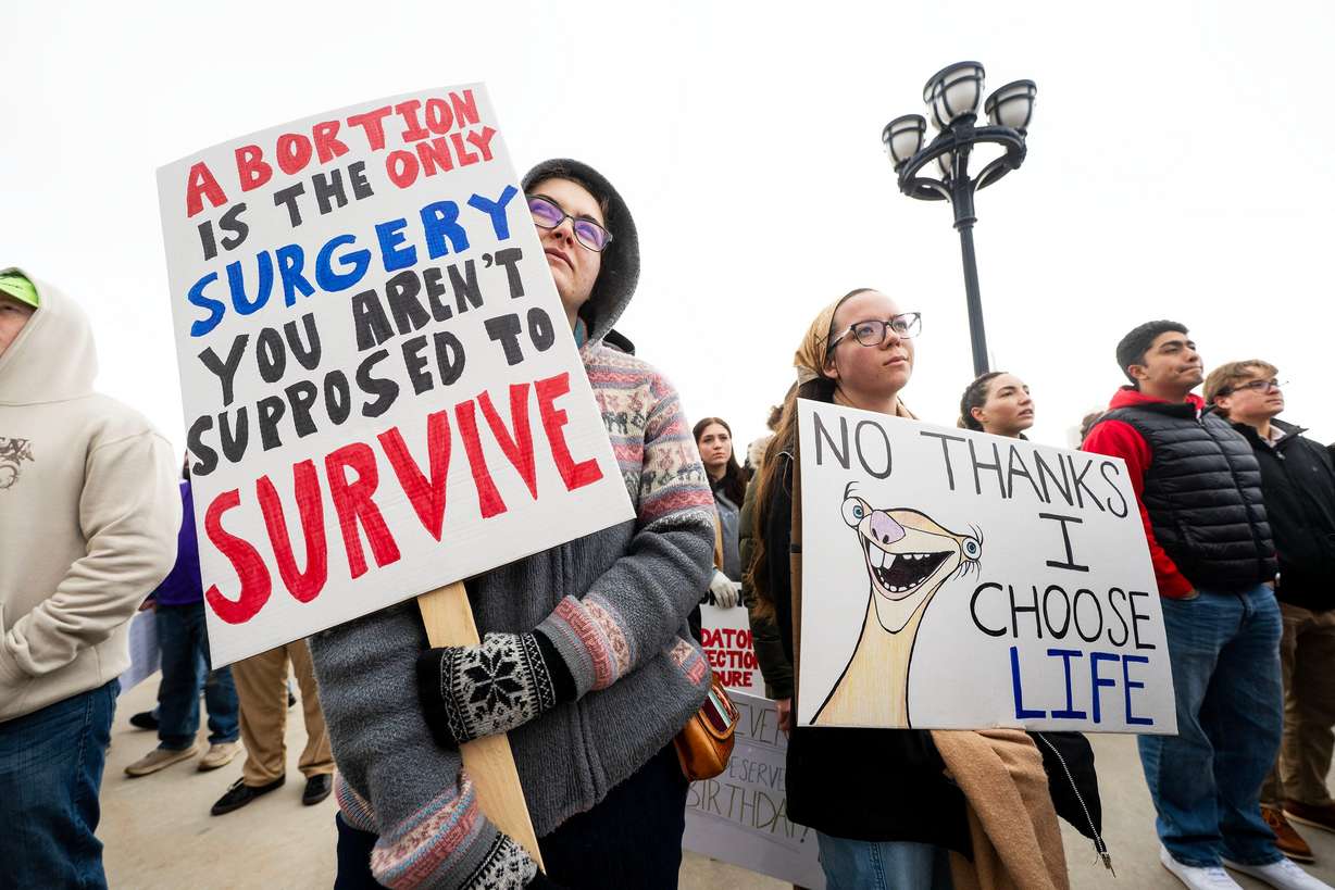 Phoebe Carroll and Lenicka Let listen with other audience members at a March for Life event at the Capitol in Salt Lake City, on Saturday. Speakers featured TurningPoint USA chapter leadership members from Brigham Young University and Utah Valley University.
