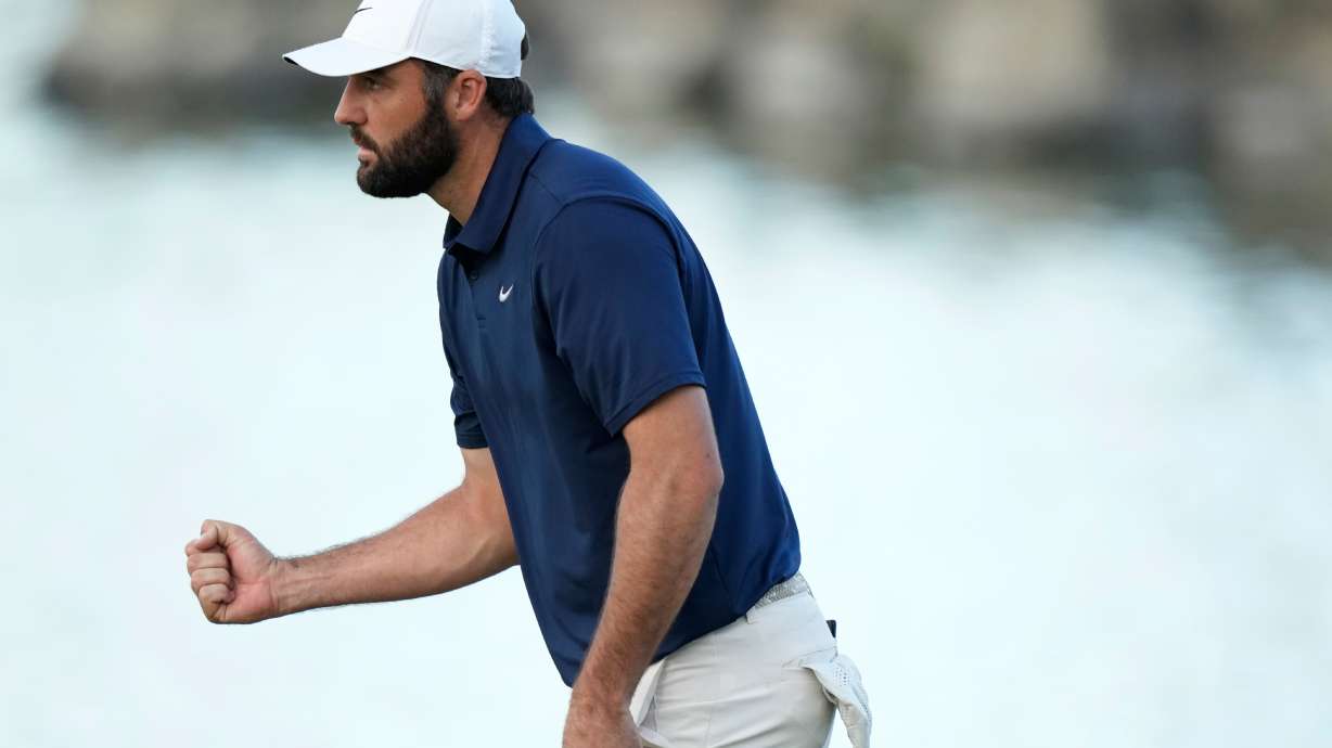 Scottie Scheffler pumps his fist after making a par on the 18th hole during the third round of the American Express golf event on the Pete Dye Stadium Course at PGA West Saturday, Jan. 24, 2026, in La Quinta, Calif.