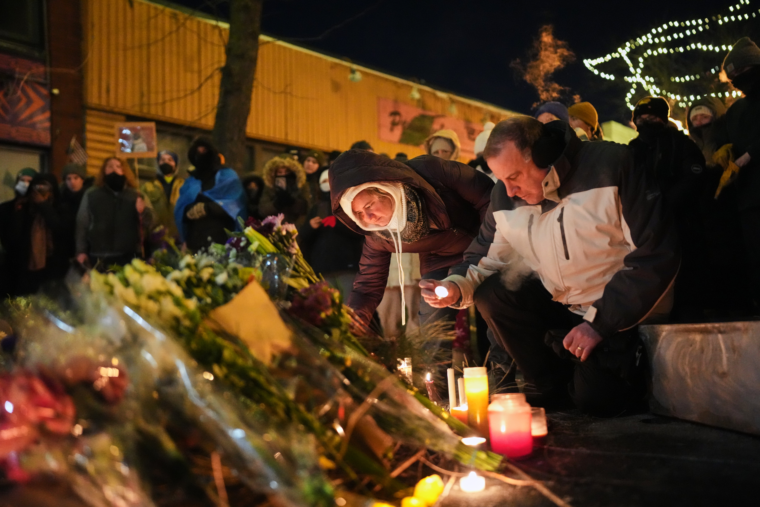 People gather during a vigil for 37-year-old Alex Pretti, who was fatally shot by a Border Patrol officer earlier in the day, Saturday in Minneapolis. The officer who shot Pretty is an eight-year Border Patrol veteran, officials said.