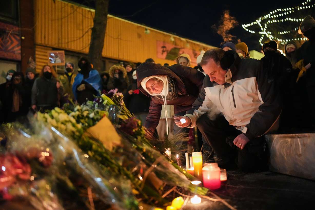 People gather during a vigil for 37-year-old Alex Pretti, who was fatally shot by a Border Patrol officer earlier in the day, Saturday in Minneapolis. The officer who shot Pretty is an eight-year Border Patrol veteran, officials said.