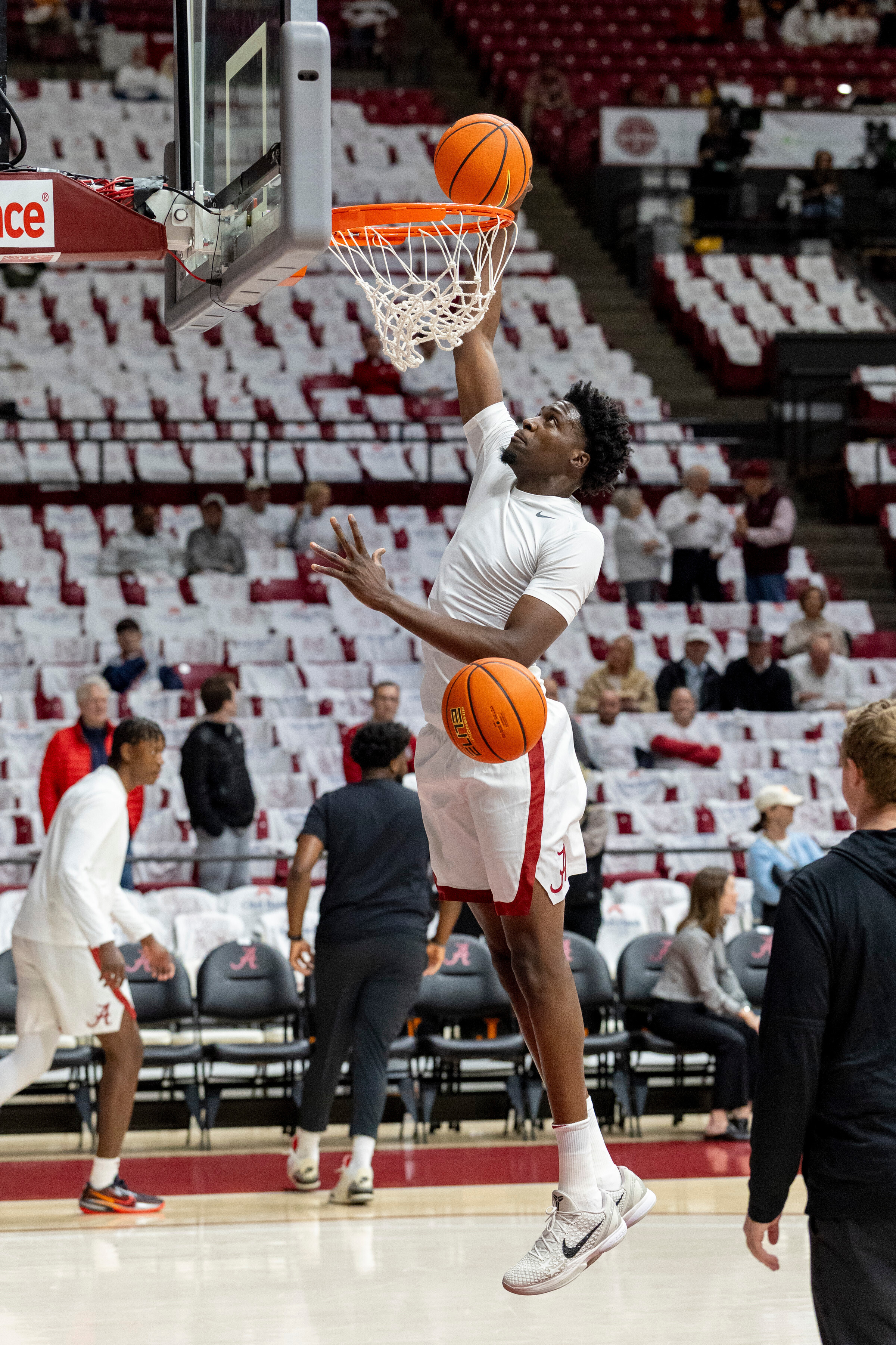 Alabama center Charles Bediako, center, warms up before an NCAA college basketball game against Tennessee, Saturday, Jan. 24, 2026, in Tuscaloosa, Ala. 