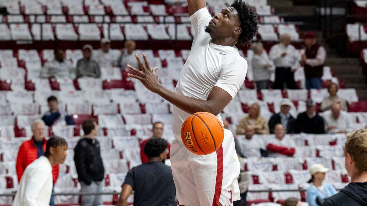 Alabama center Charles Bediako, center, warms up before an NCAA college basketball game against Tennessee, Saturday, Jan. 24, 2026, in Tuscaloosa, Ala.