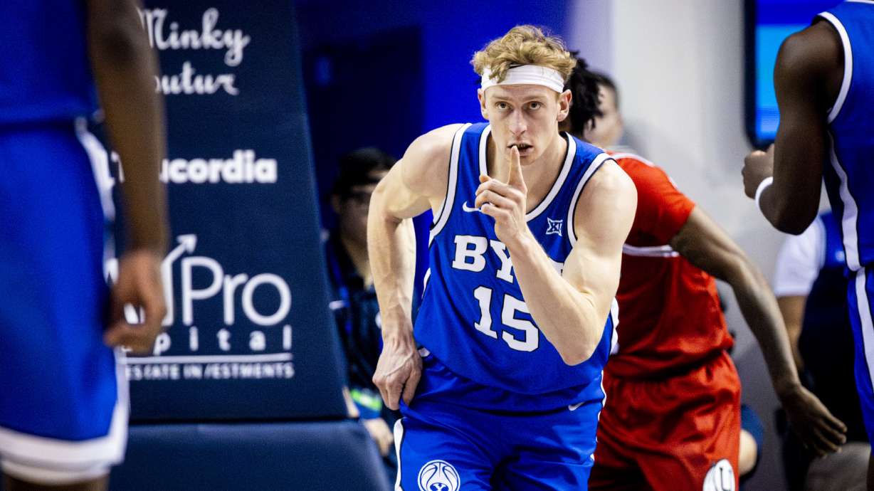 BYU guard Richie Saunders (15) points to forward AJ Dybantsa (3) after Saunders scored a basket on an assist from Dybantsa during an NCAA basketball game held at the Marriott Center in Provo on Saturday, Jan. 24, 2026.