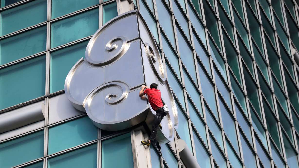 Rock climber Alex Honnold performs a free solo climb of the Taipei 101 skyscraper in Taipei, Taiwan, Sunday. Honnold completed the climb without ropes or protective equipment.