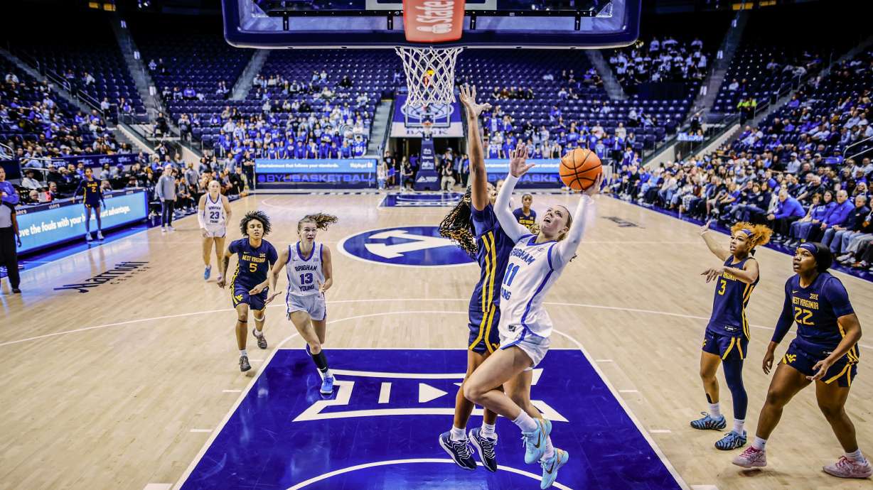 BYU guard Delaney Gibb drives to the rim during a Big 12 women's basketball game against No. 22 West Virginia, Saturday, Jan. 24, 2026 in Provo, Utah.