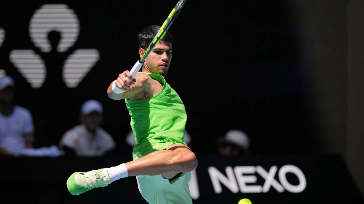Carlos Alcaraz of Spain kicks the ball during his fourth round match against Tommy Paul of the U.S. at the Australian Open tennis championship in Melbourne, Australia, Sunday, Jan. 25, 2026.