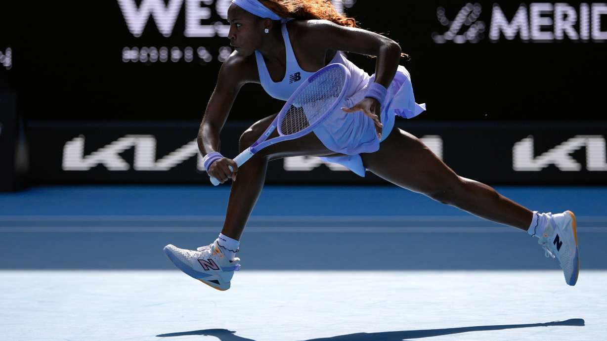 Coco Gauff of the U.S. plays a backhand return to Karolina Muchova of the Czech Republic during their fourth round match at the Australian Open tennis championship in Melbourne, Australia, Sunday, Jan. 25, 2026.