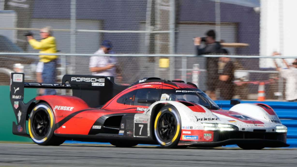 Felipe Nasr, of Brazil, enters a turn in a Porsche 963 during the Rolex 24 hour auto race at Daytona International Speedway, Sunday, Jan. 25, 2026, in Daytona Beach, Fla.