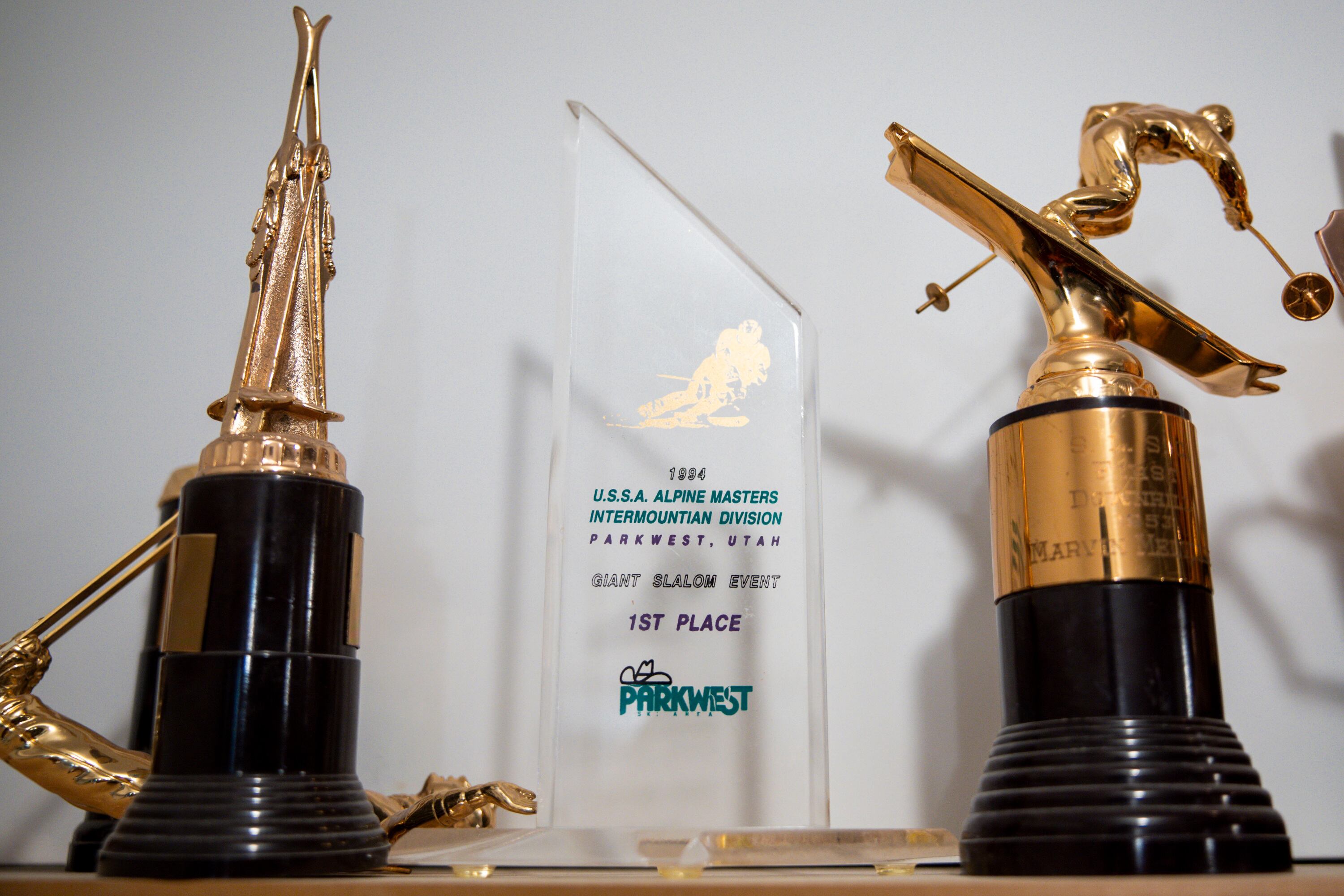 Awards and trophies sit on a shelf in the basement of Marvin Melville’s home in Cottonwood Heights on Dec. 15, 2025.