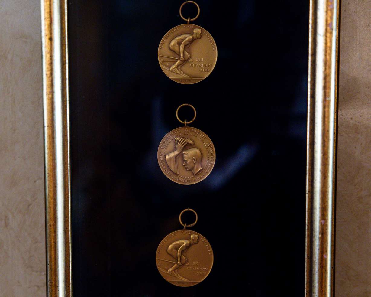 NCAA medals hang in a case near the door of Marvin Melville’s home in Cottonwood Heights on Dec. 15, 2025.