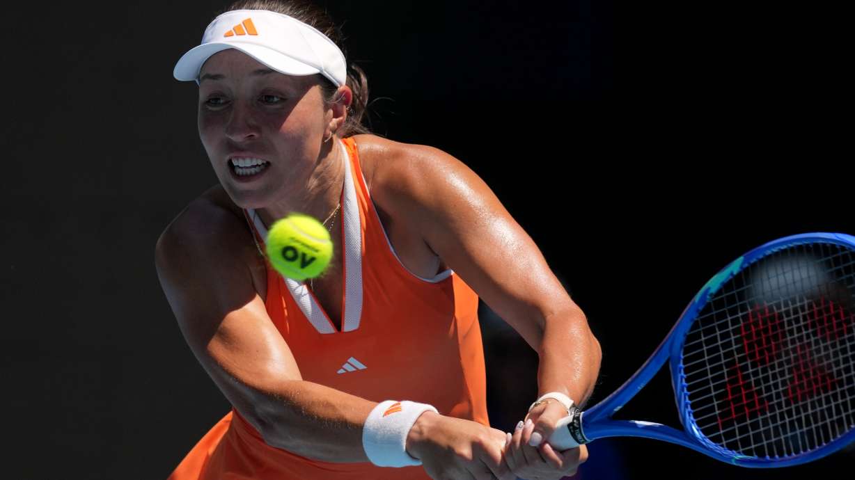 Jessica Pegula of the U.S. plays a backhand return to her compatriot Madison Keys during their fourth round match at the Australian Open tennis championship in Melbourne, Australia, Monday, Jan. 26, 2026.