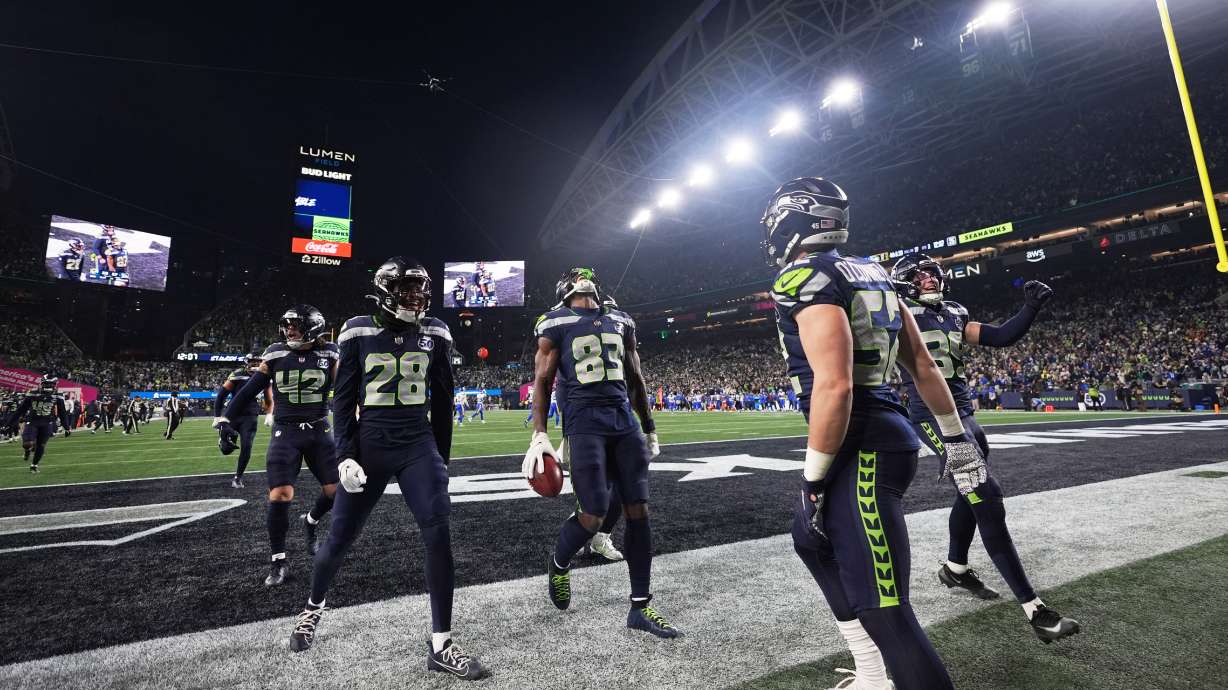 Seattle Seahawks' Dareke Young (83) celebrates after recovering a fumble by Los Angeles Rams wide receiver Xavier Smith during a punt return during the second half of the NFC Championship NFL football game Sunday, Jan. 25, 2026, in Seattle.